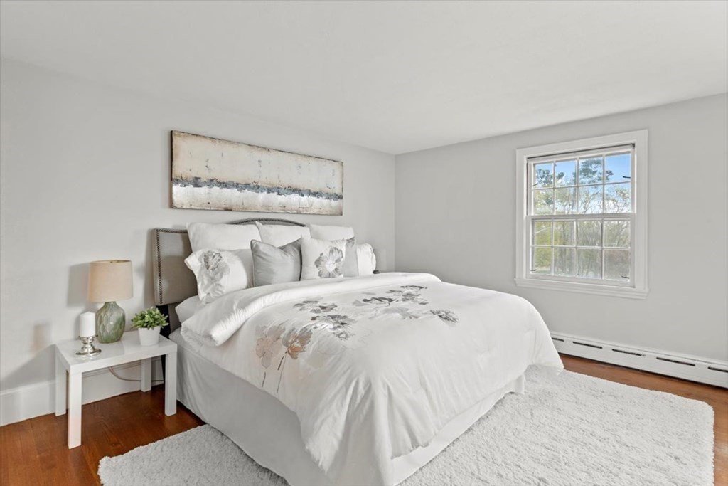 54 Ober Street Beverly, MA 01915 - Photo 20 of 40 a bedroom with a bed and wooden floor