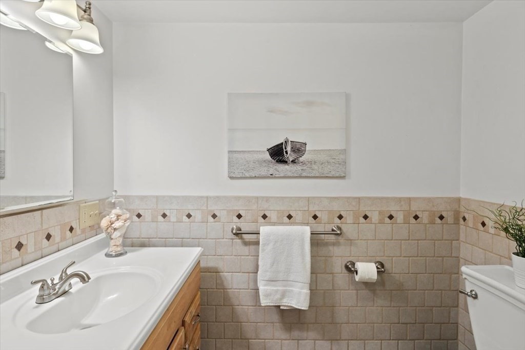 54 Ober Street Beverly, MA 01915 - Photo 23 of 40 a bathroom with a sink and a mirror