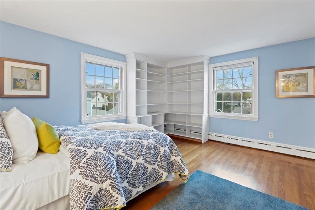 54 Ober Street Beverly, MA 01915 - Photo 27 of 40 a bedroom with a bed and wooden floor