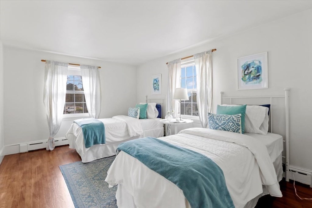54 Ober Street Beverly, MA 01915 - Photo 28 of 40 a bedroom with two beds and a large window