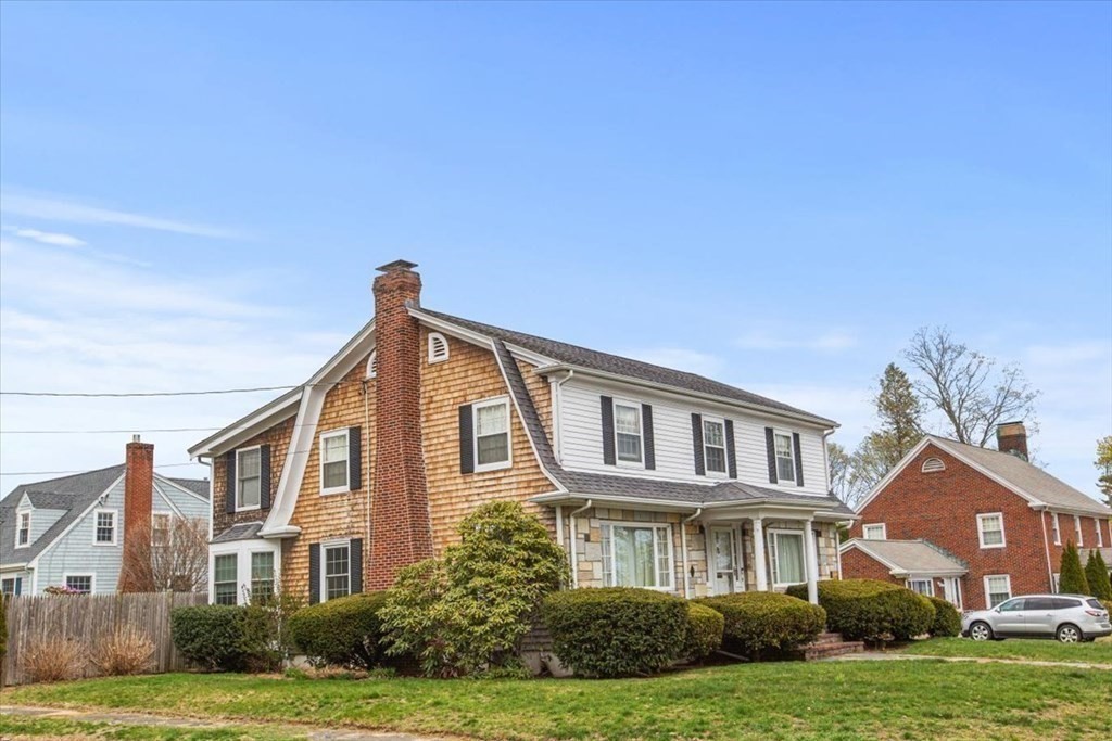 54 Ober Street Beverly, MA 01915 - Photo 3 of 40 a front view of a house with a yard
