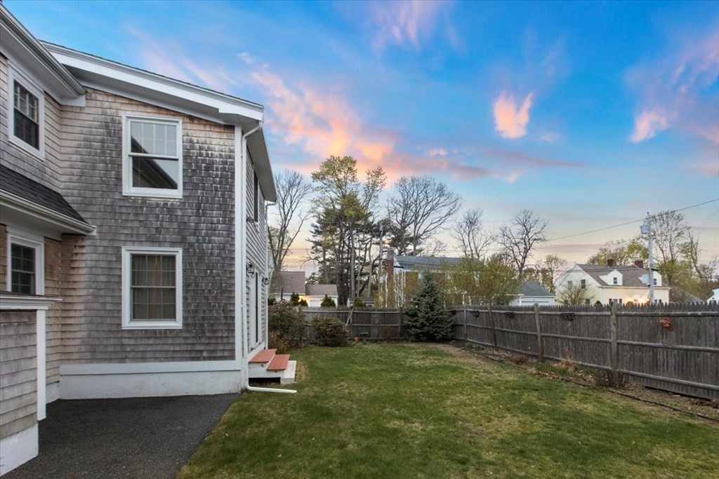 54 Ober Street Beverly, MA 01915 - Photo 32 of 40 a backyard of a house with lots of green space