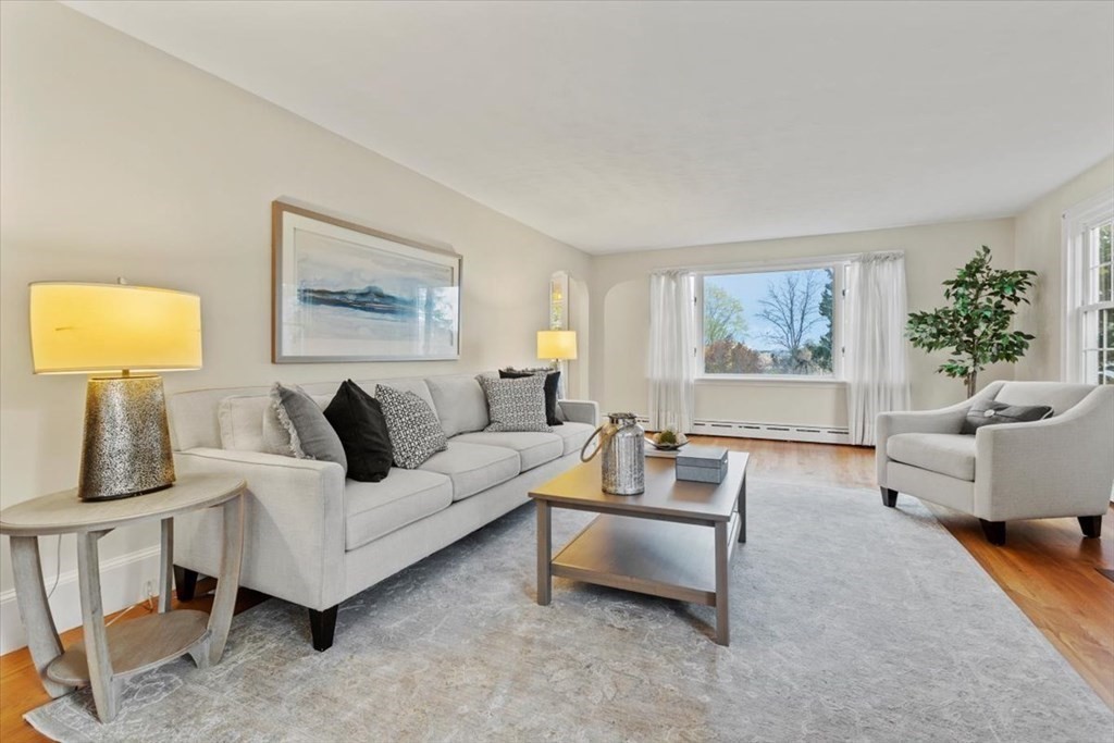 54 Ober Street Beverly, MA 01915 - Photo 4 of 40 a living room with furniture and a painting on the wall