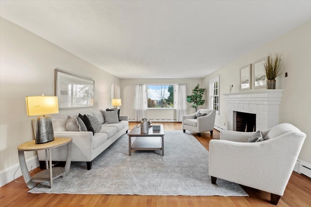 54 Ober Street Beverly, MA 01915 - Photo 5 of 40 a living room with furniture and a fireplace
