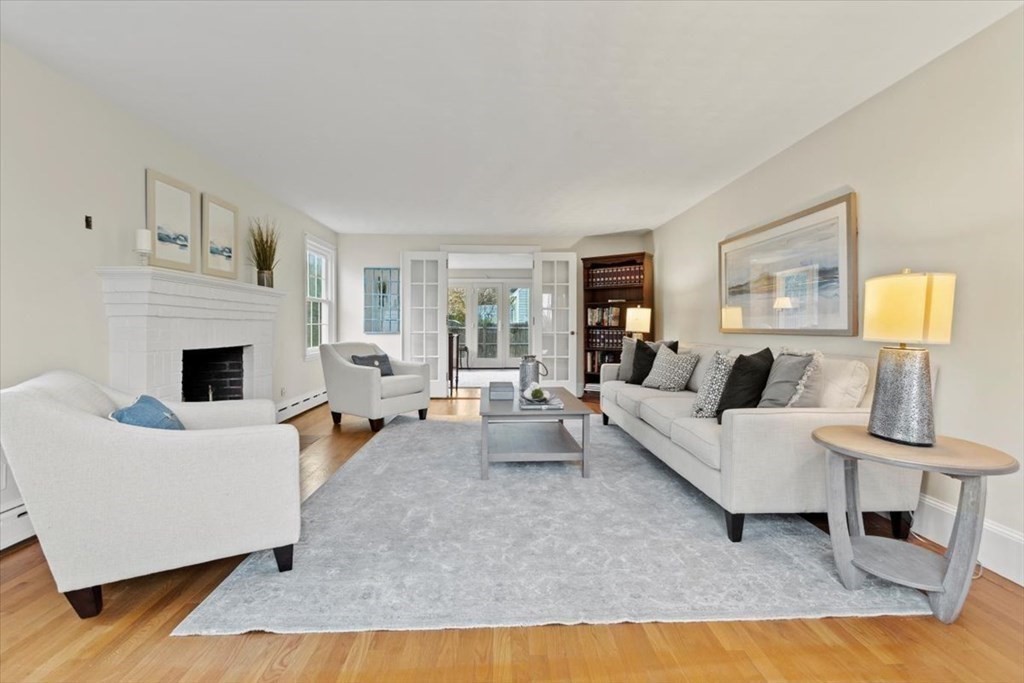 54 Ober Street Beverly, MA 01915 - Photo 6 of 40 a living room with furniture and a fireplace