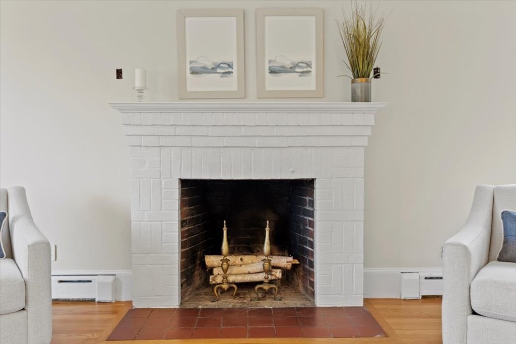 54 Ober Street Beverly, MA 01915 - Photo 7 of 40 a living room with furniture and a fireplace