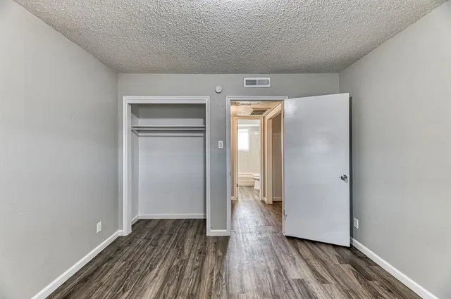 a view of hallway with wooden floor