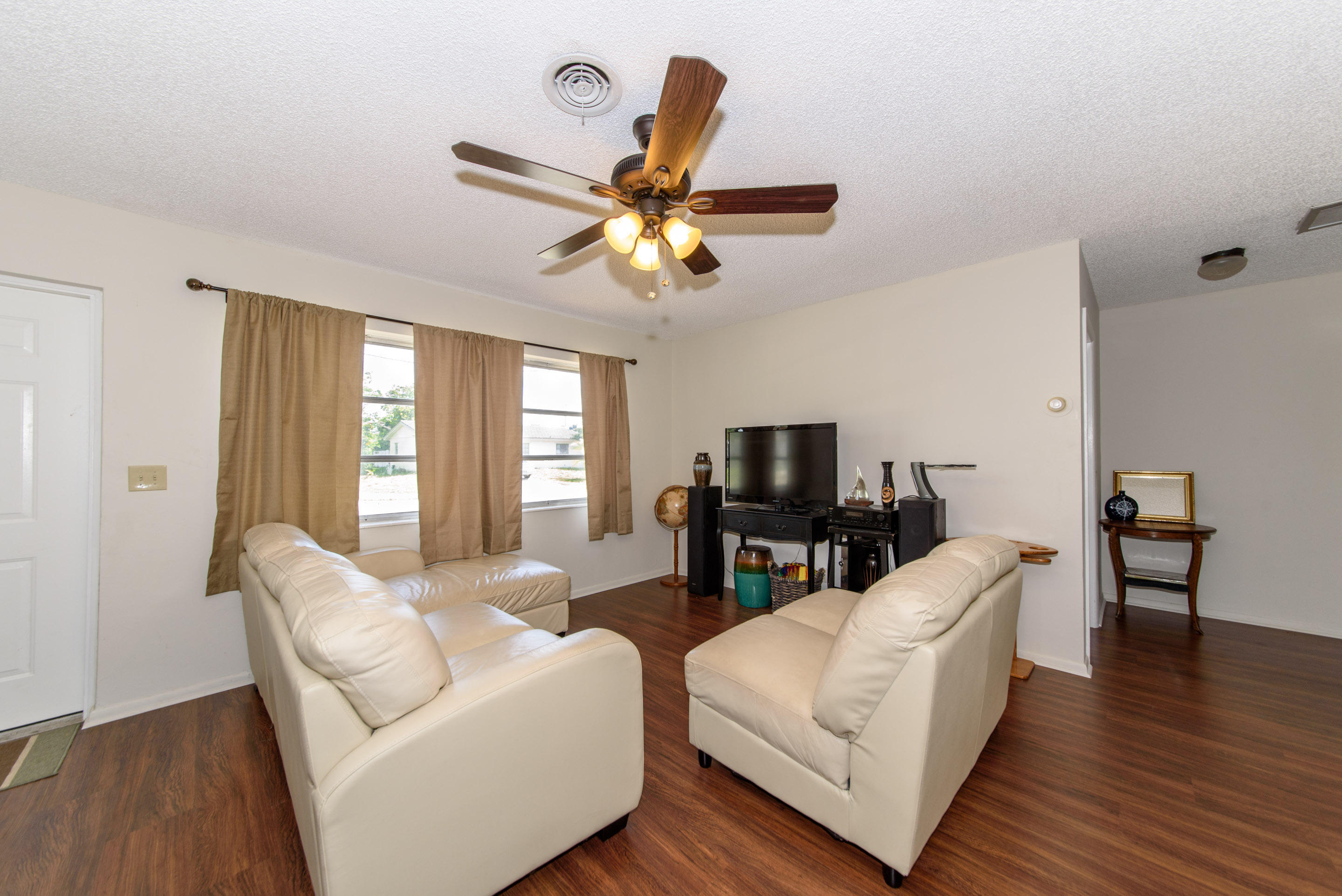 700 Southwest 14th Street Deerfield Beach, FL 33441 - Photo 3 of 13 a living room with furniture fireplace and a flat screen tv