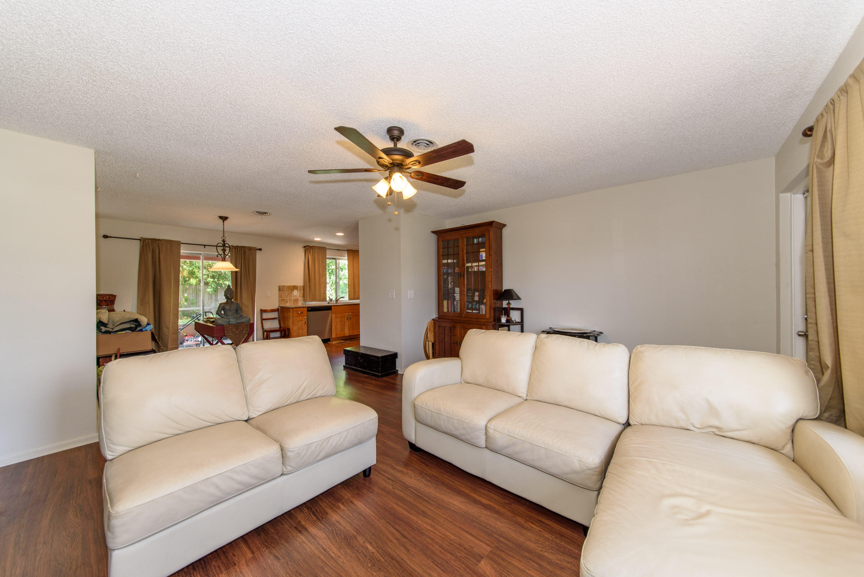 700 Southwest 14th Street Deerfield Beach, FL 33441 - Photo 4 of 13 a living room with furniture and a ceiling fan