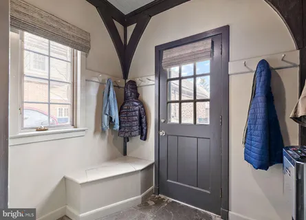 a very nice looking room with a large window and mirror