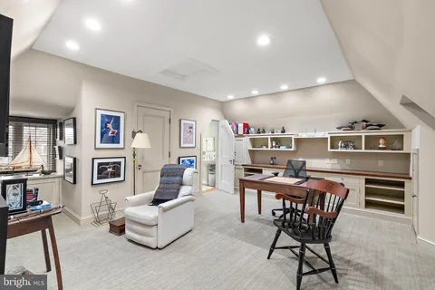 a living room with furniture and flat screen tv