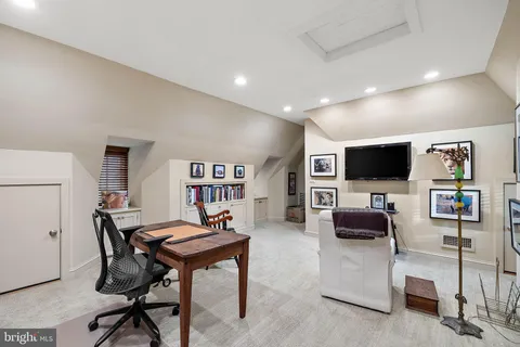 a view of a livingroom with furniture and a flat screen tv