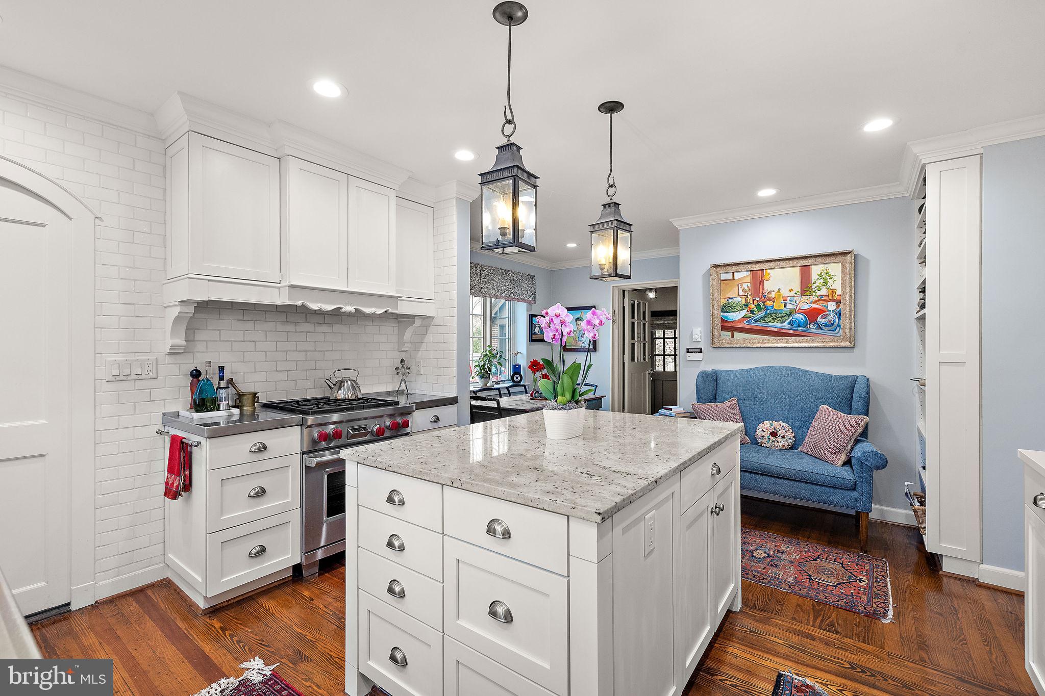 912 Nottingham Road Wilmington, DE 19805 - Photo 7 of 49 a kitchen that has a lot of cabinets a sink and wooden floor