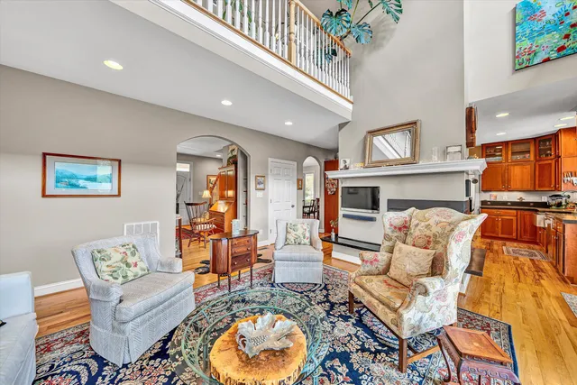 a living room with patio bathtub and dining table view