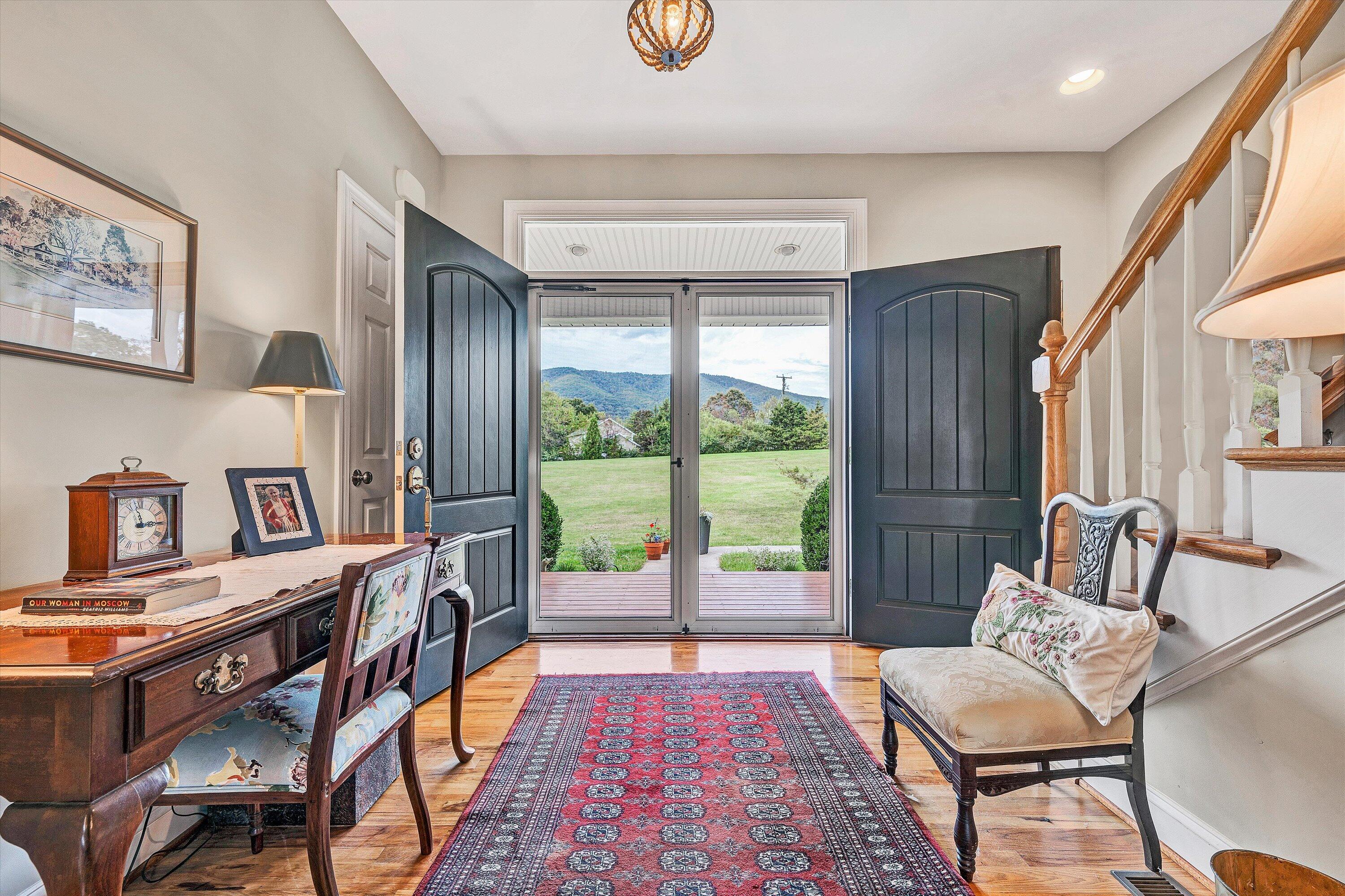 84 Green Level Road Boones Mill, VA 24065 - Photo 2 of 57 a living room with furniture and a floor to ceiling window