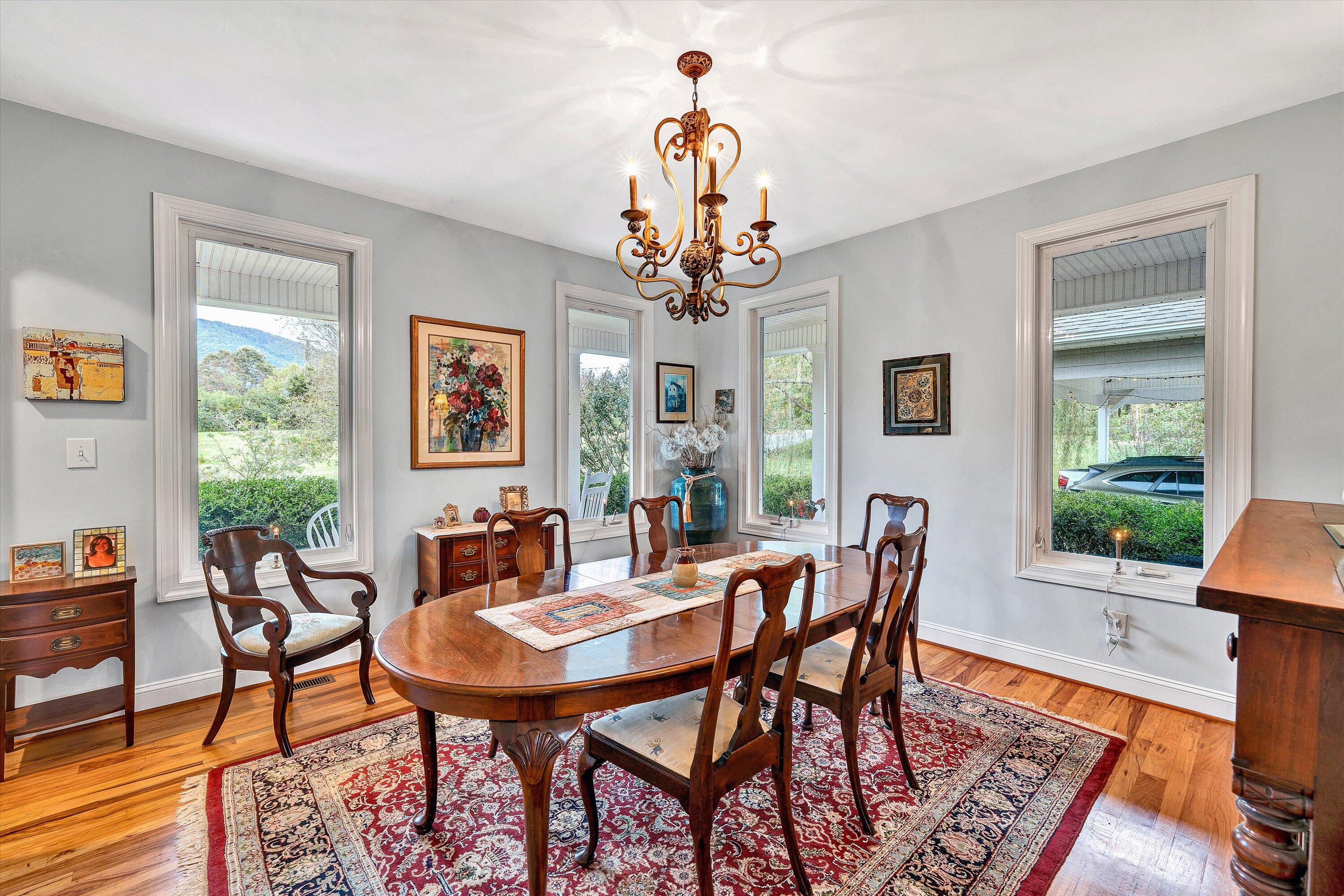 84 Green Level Road Boones Mill, VA 24065 - Photo 27 of 57 a view of a dining room with furniture window and wooden floor