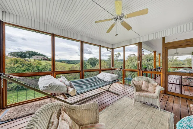 a view of a balcony with wooden floor