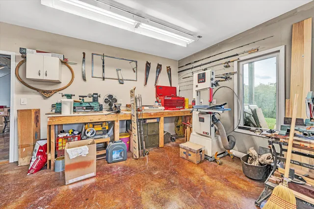 a view of a patio with table and chairs and wooden floor