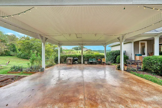 a view of a balcony with chair and wooden floor