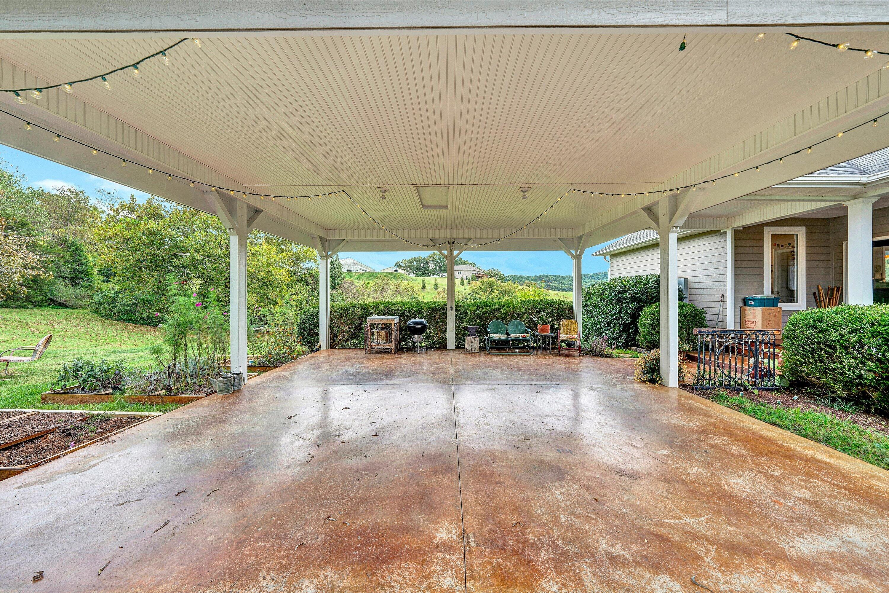 84 Green Level Road Boones Mill, VA 24065 - Photo 43 of 57 a view of a backyard with porch and garden