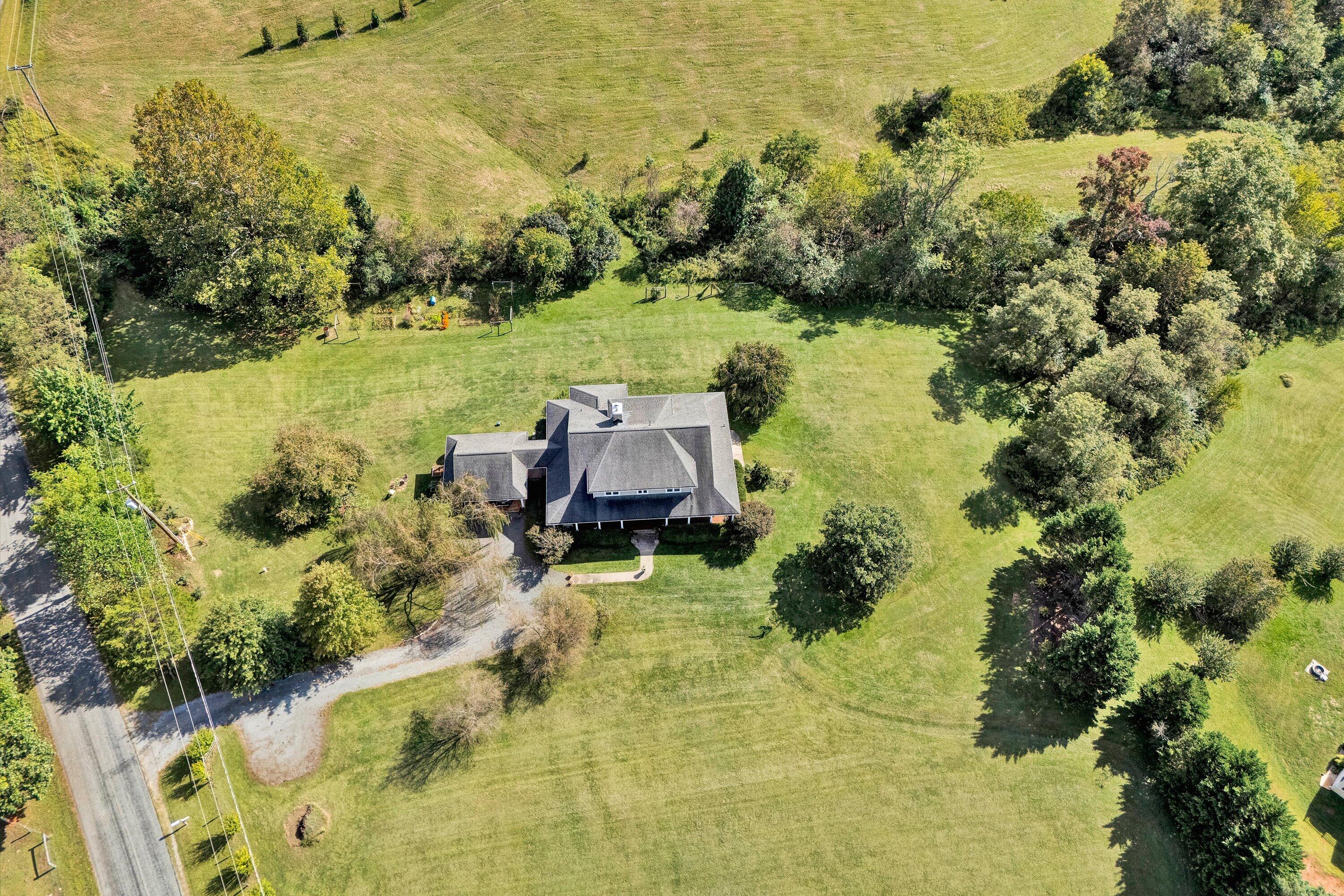 84 Green Level Road Boones Mill, VA 24065 - Photo 51 of 57 a view of a lake with a mountain in the background