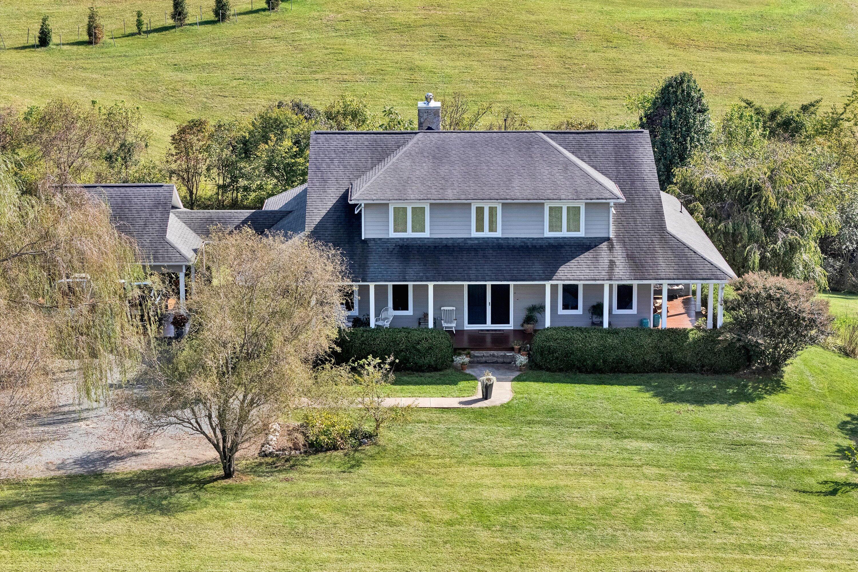 84 Green Level Road Boones Mill, VA 24065 - Photo 6 of 57 a aerial view of a house with swimming pool and a yard