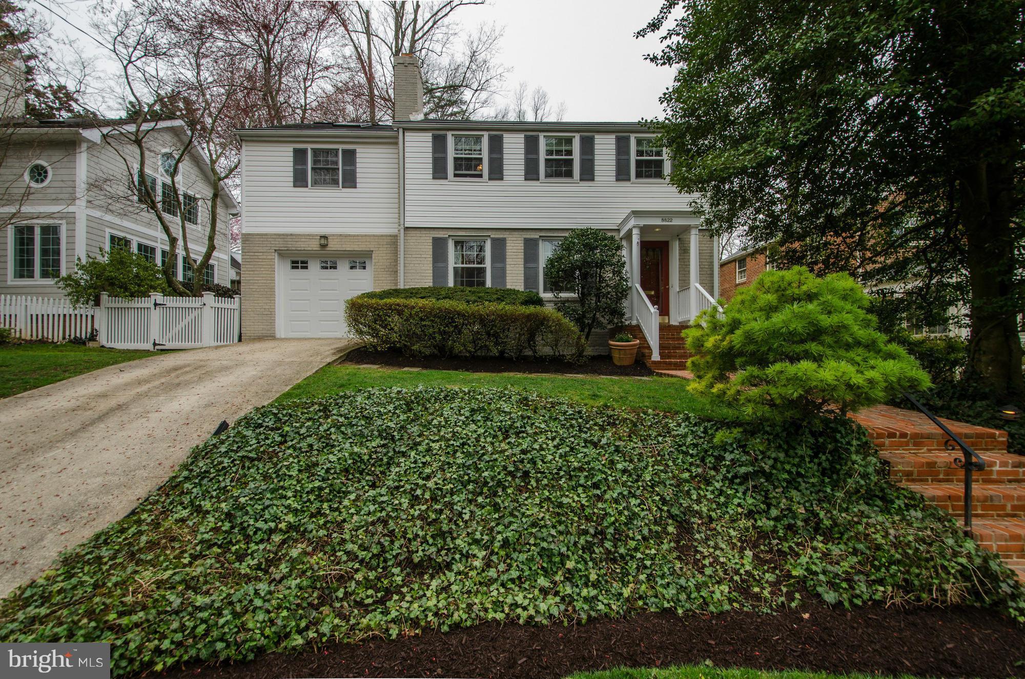 8822 Ridge Road Bethesda, MD 20817 - Photo 1 of 20 a front view of a house with a yard and potted plants