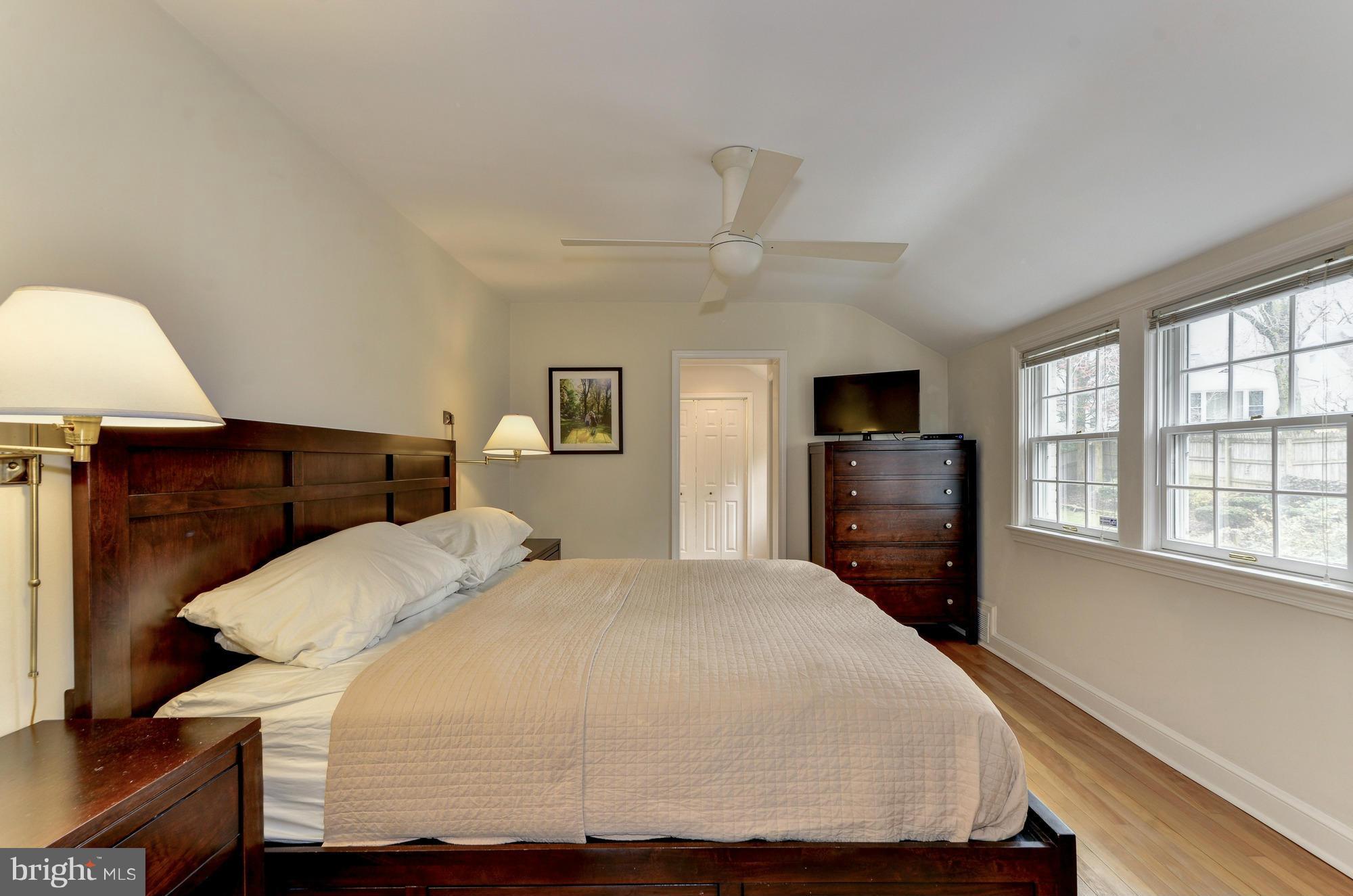 8822 Ridge Road Bethesda, MD 20817 - Photo 12 of 20 a bedroom with a bed and tv with window