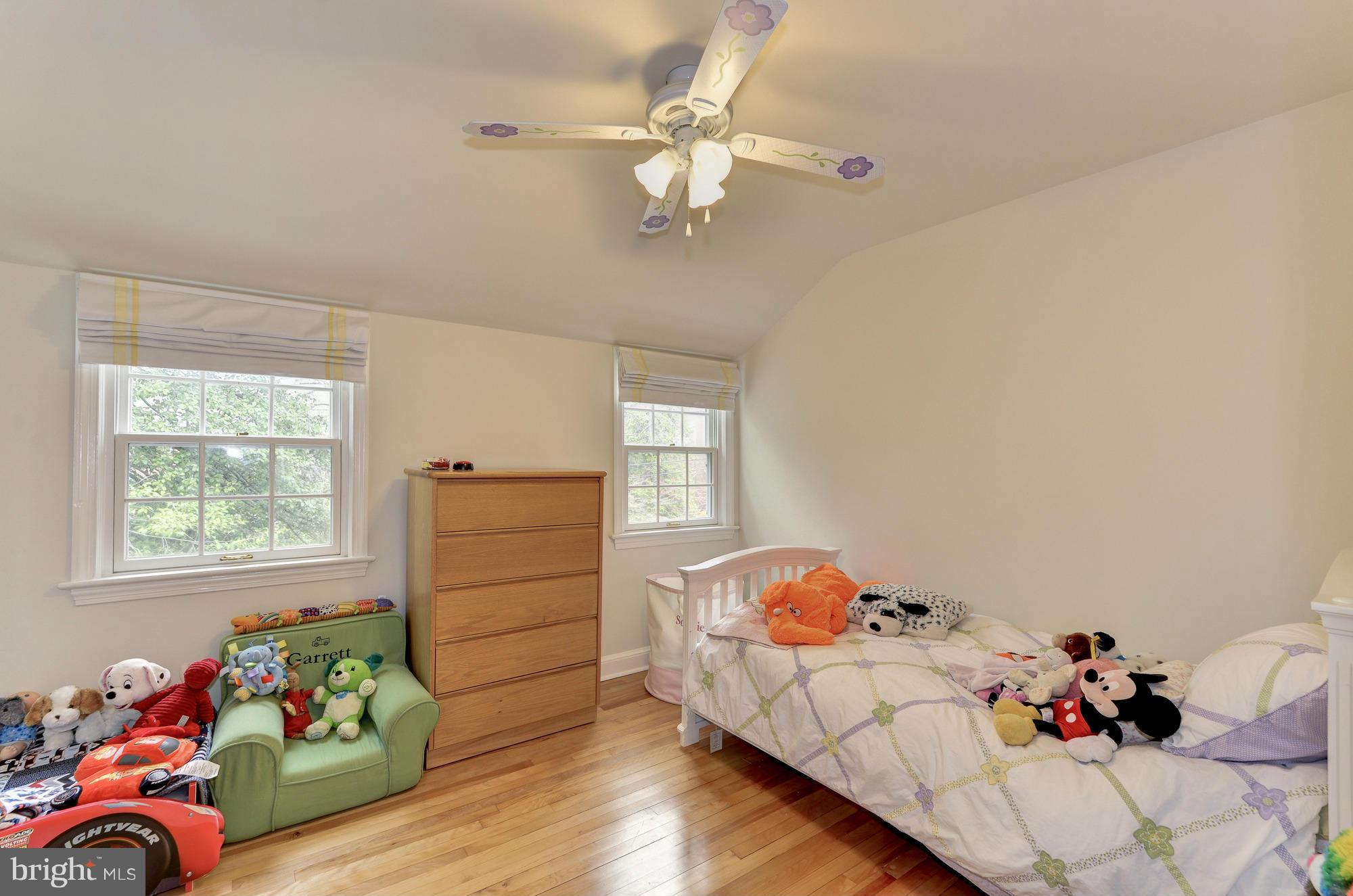 8822 Ridge Road Bethesda, MD 20817 - Photo 14 of 20 a bed room with bed and a window