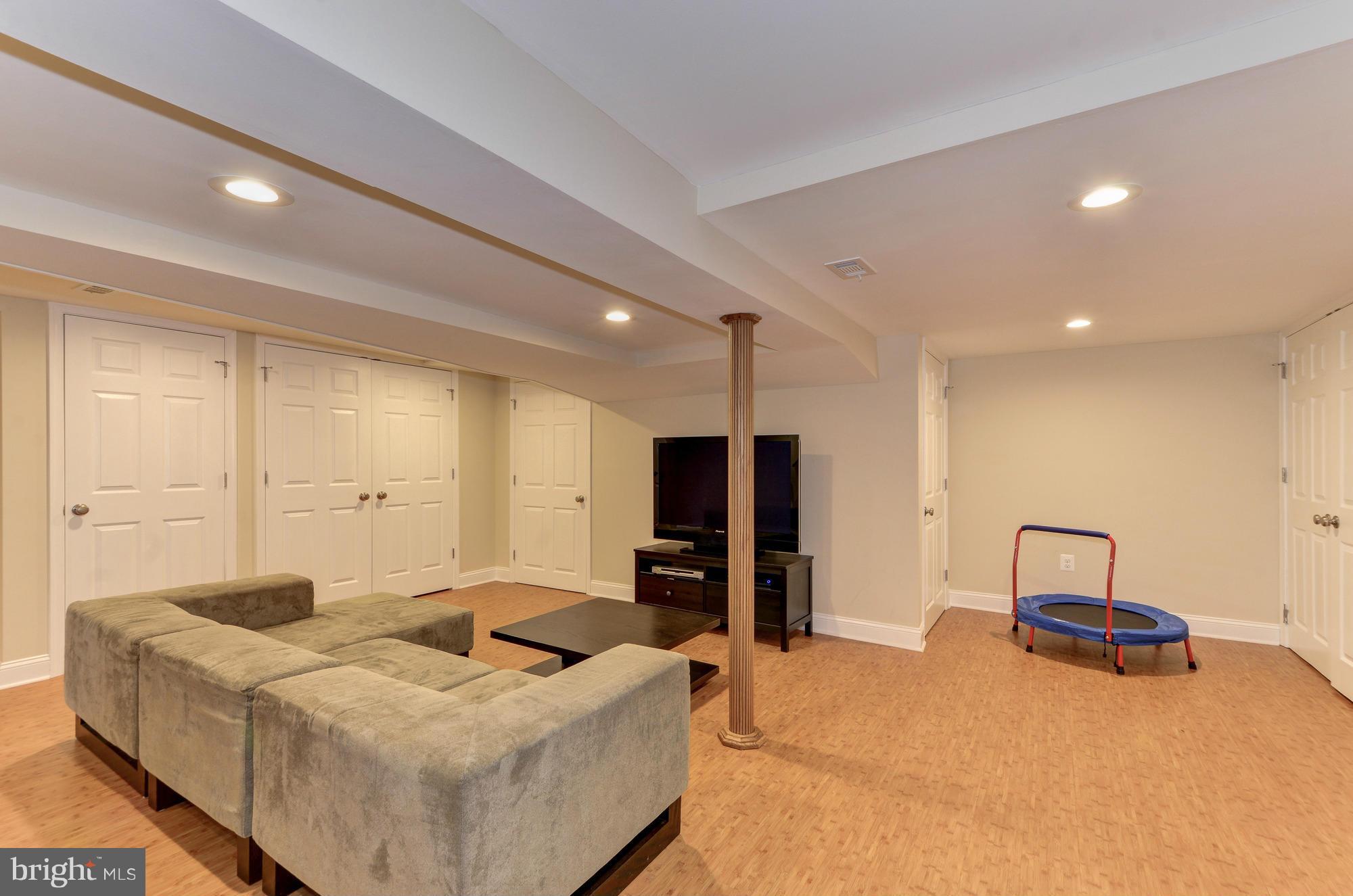 8822 Ridge Road Bethesda, MD 20817 - Photo 16 of 20 a living room with furniture and a flat screen tv