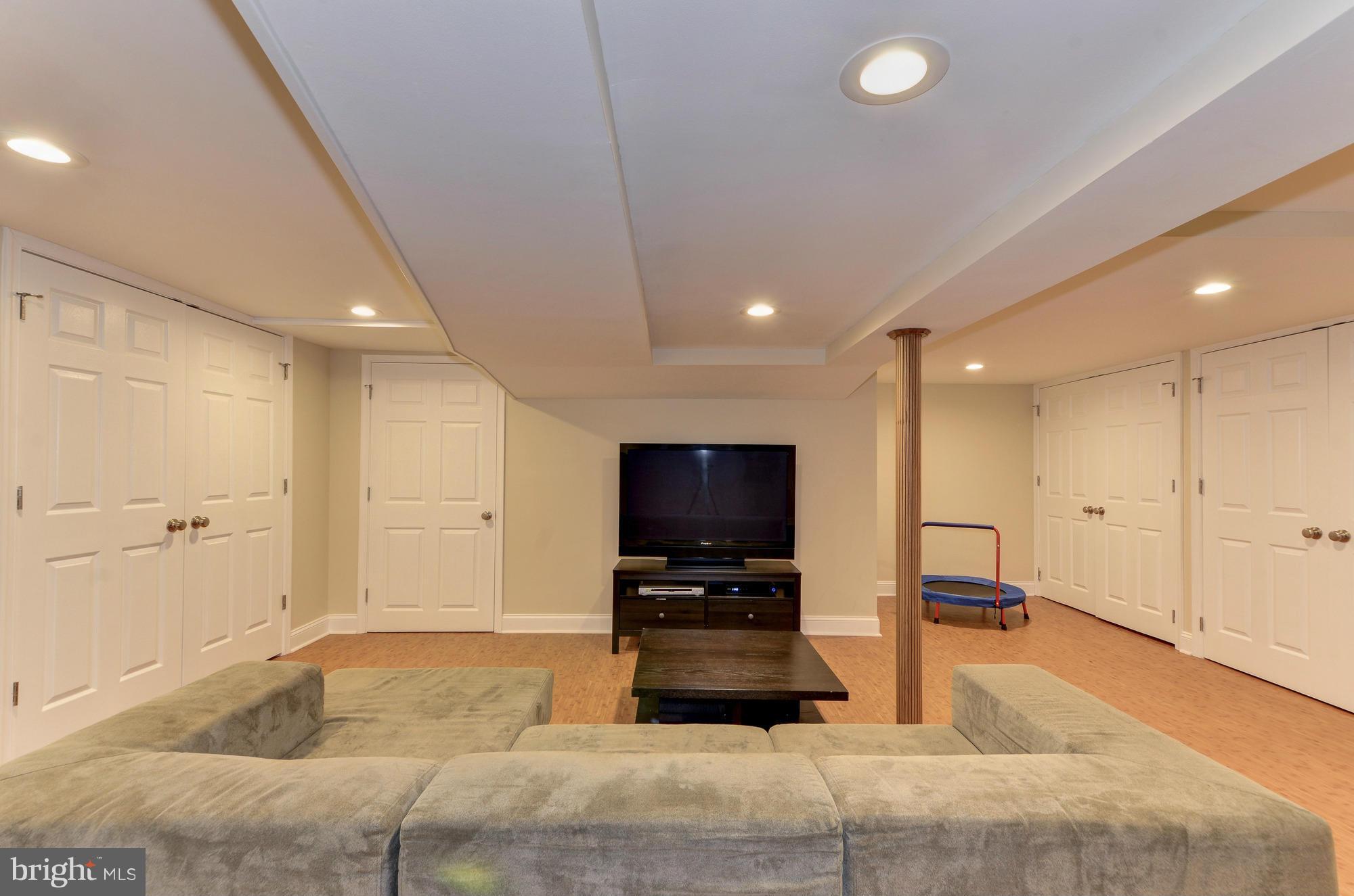 8822 Ridge Road Bethesda, MD 20817 - Photo 20 of 20 a living room with furniture and a flat screen tv
