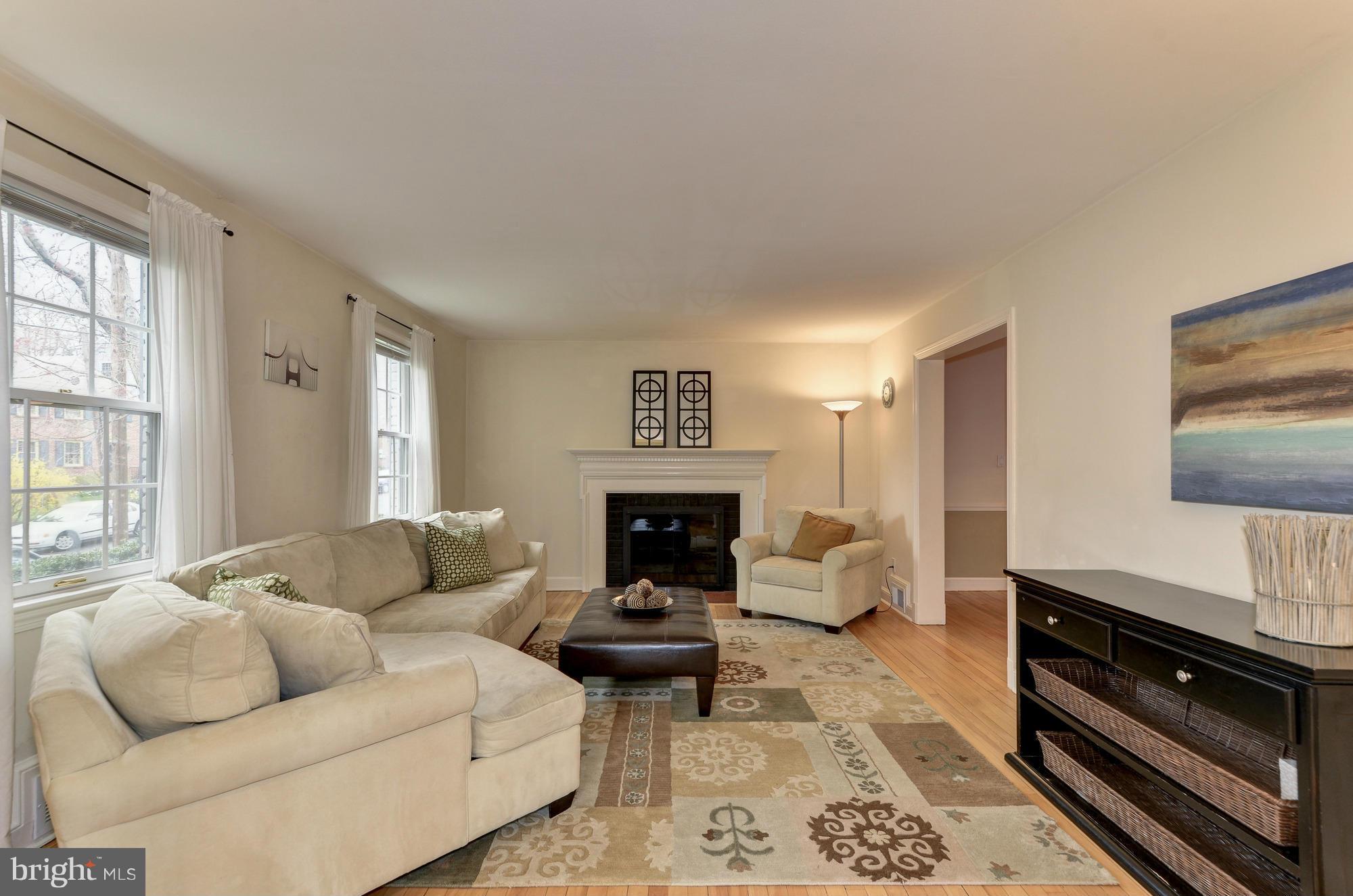 8822 Ridge Road Bethesda, MD 20817 - Photo 3 of 20 a living room with furniture or couch and a fireplace