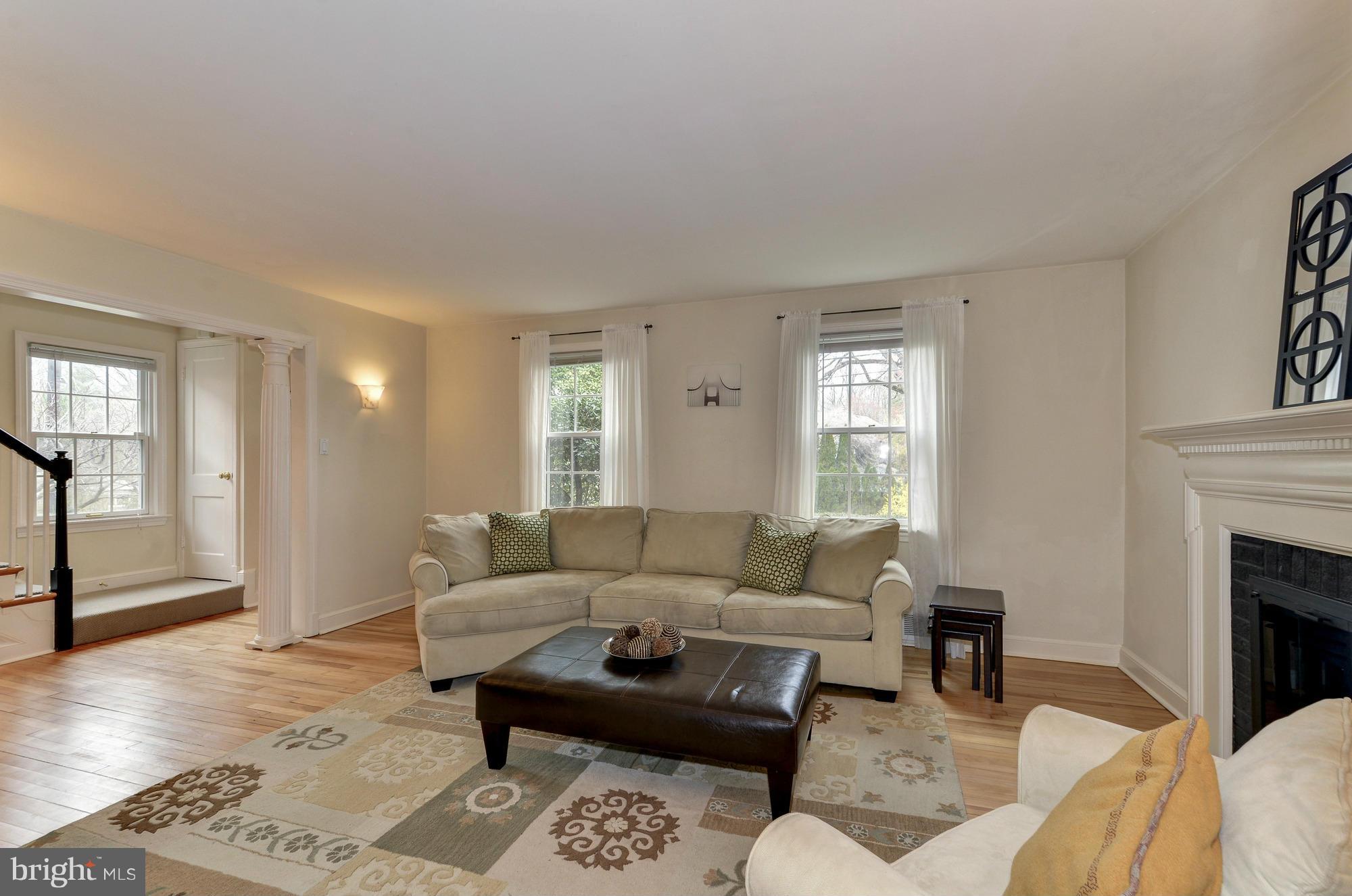 8822 Ridge Road Bethesda, MD 20817 - Photo 4 of 20 a living room with furniture and a fireplace
