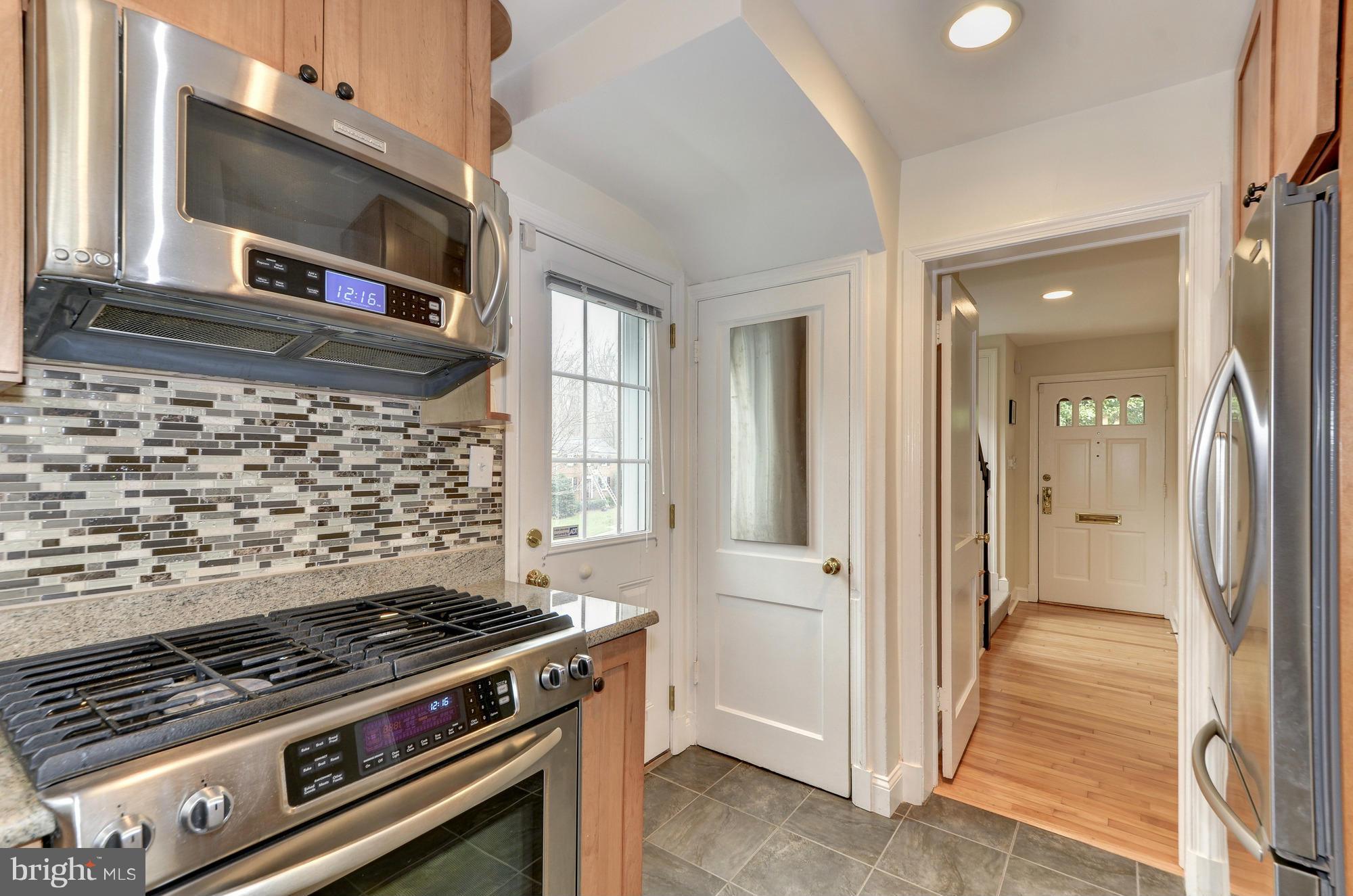 8822 Ridge Road Bethesda, MD 20817 - Photo 6 of 20 a view of a kitchen with wooden floor and a stove top oven