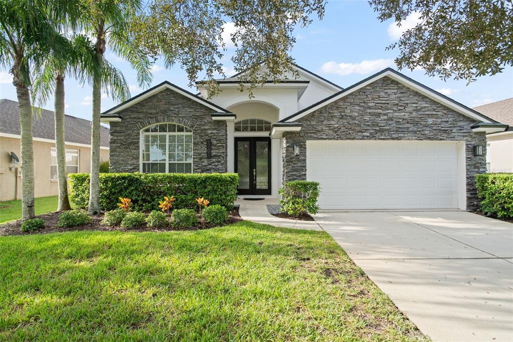 1701 Cherry Ridge Drive Lake Mary, FL 32746 - Photo 1 of 1 a front view of a house with a yard