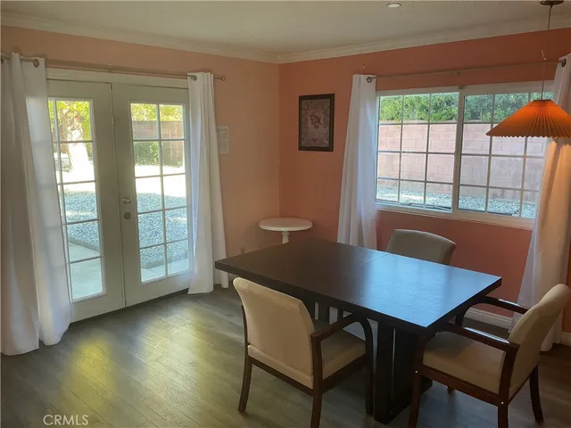 a view of a dining room with furniture and window