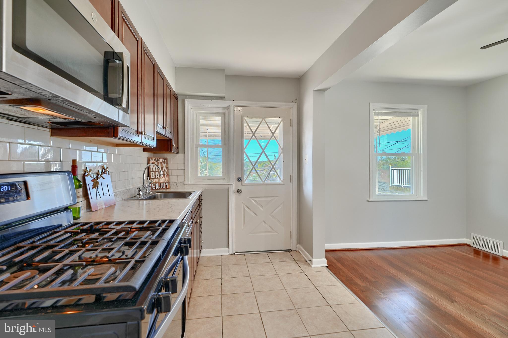 530 47th Street Baltimore, MD 21224 - Photo 14 of 29 Kitchen door leads to covered balcony
