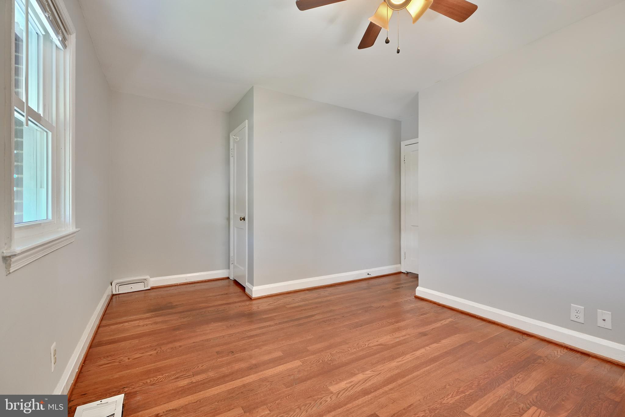 530 47th Street Baltimore, MD 21224 - Photo 18 of 29 Hardwood floors in primary bedroom