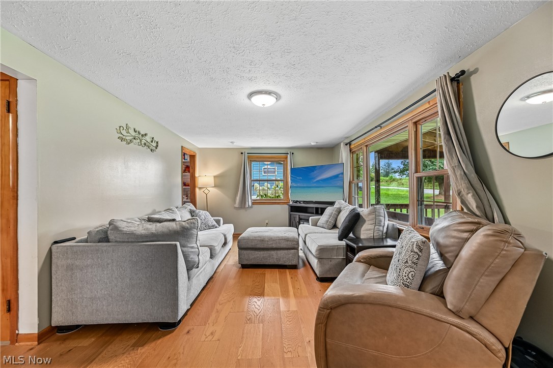 15111 Mt Eaton Road North Rittman, OH 44270 - Photo 7 of 50 Likving room with large picture window and wood flooring