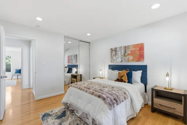 a bedroom with bed and window