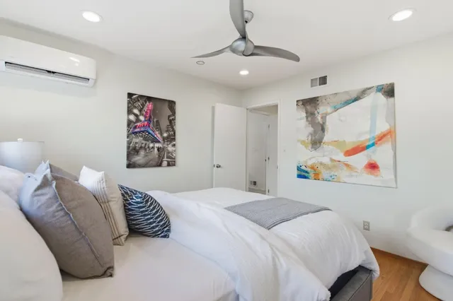 a living room with furniture a dining table and kitchen view