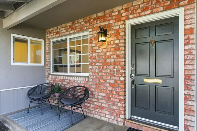 a living room with furniture and a rug