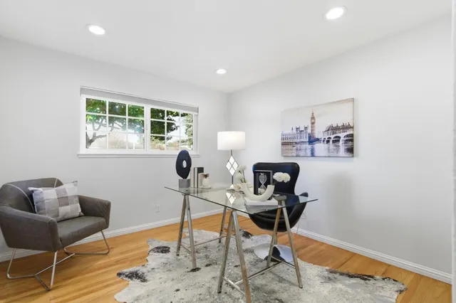 a bathroom with a tub shower and mirror