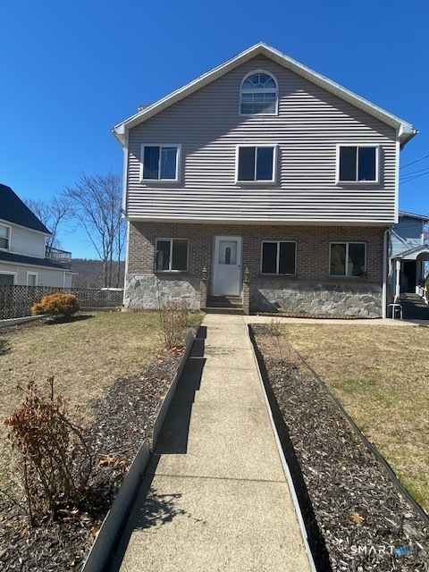 42-44 High Street Naugatuck, CT 06770 - Photo 1 of 8 a front view of a house with a yard
