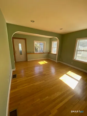a view of a bathroom with a tub and window