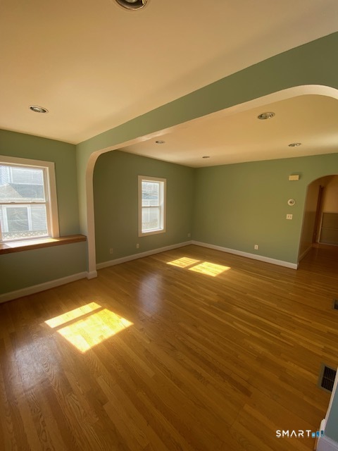 42-44 High Street Naugatuck, CT 06770 - Photo 3 of 8 a view of a big room with wooden floor and windows