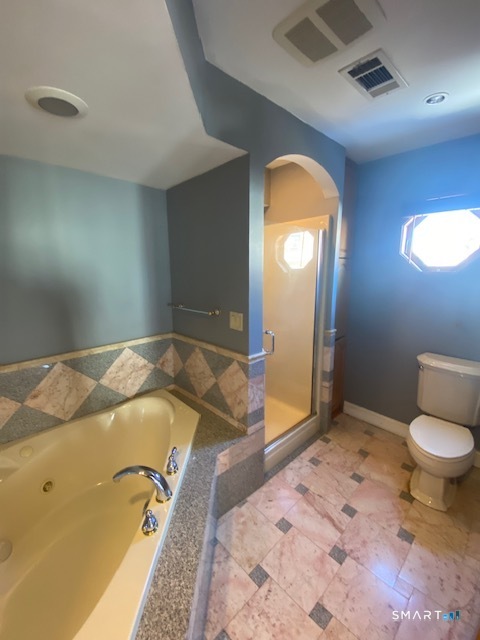 42-44 High Street Naugatuck, CT 06770 - Photo 5 of 8 a bedroom with a bed and a mirror