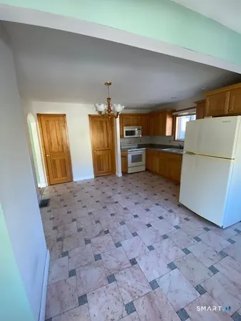 a very nice looking room with a kitchen