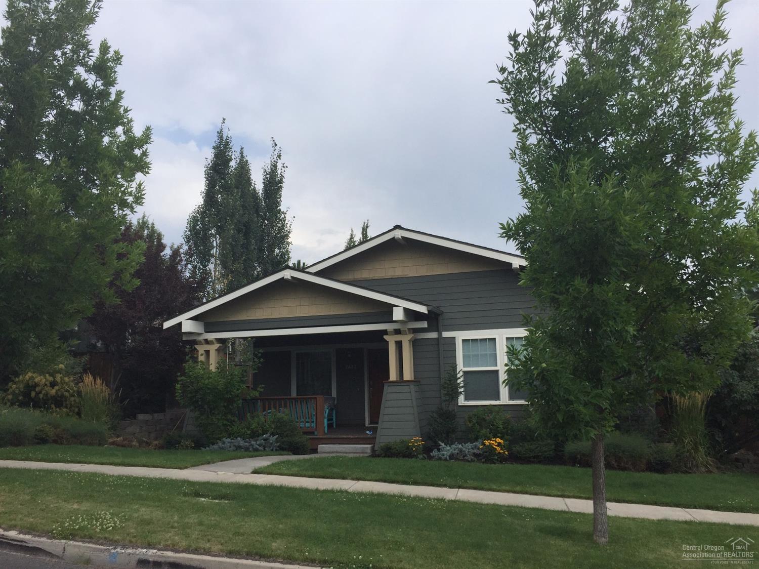 2422 Northwest Awbrey Road Bend, OR 97703 - Photo 3 of 21 a front view of a house with a yard and trees
