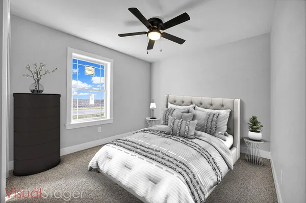 a bedroom with bed and window